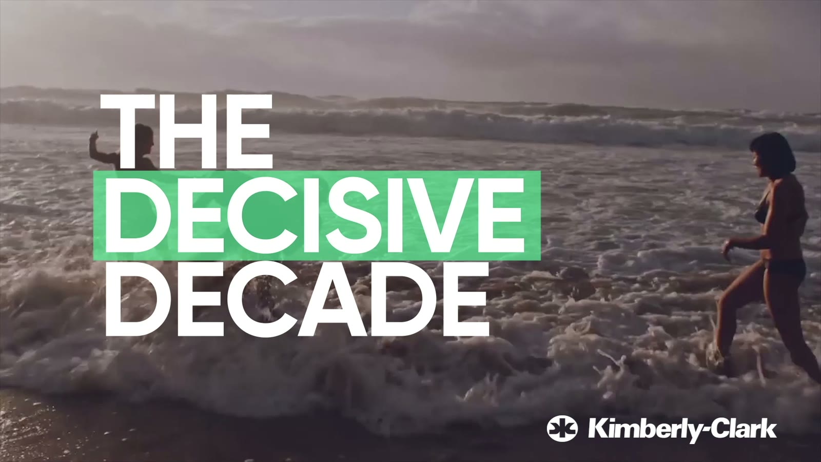 Title card: The Decisive Decade, over a woman wading into the sea
