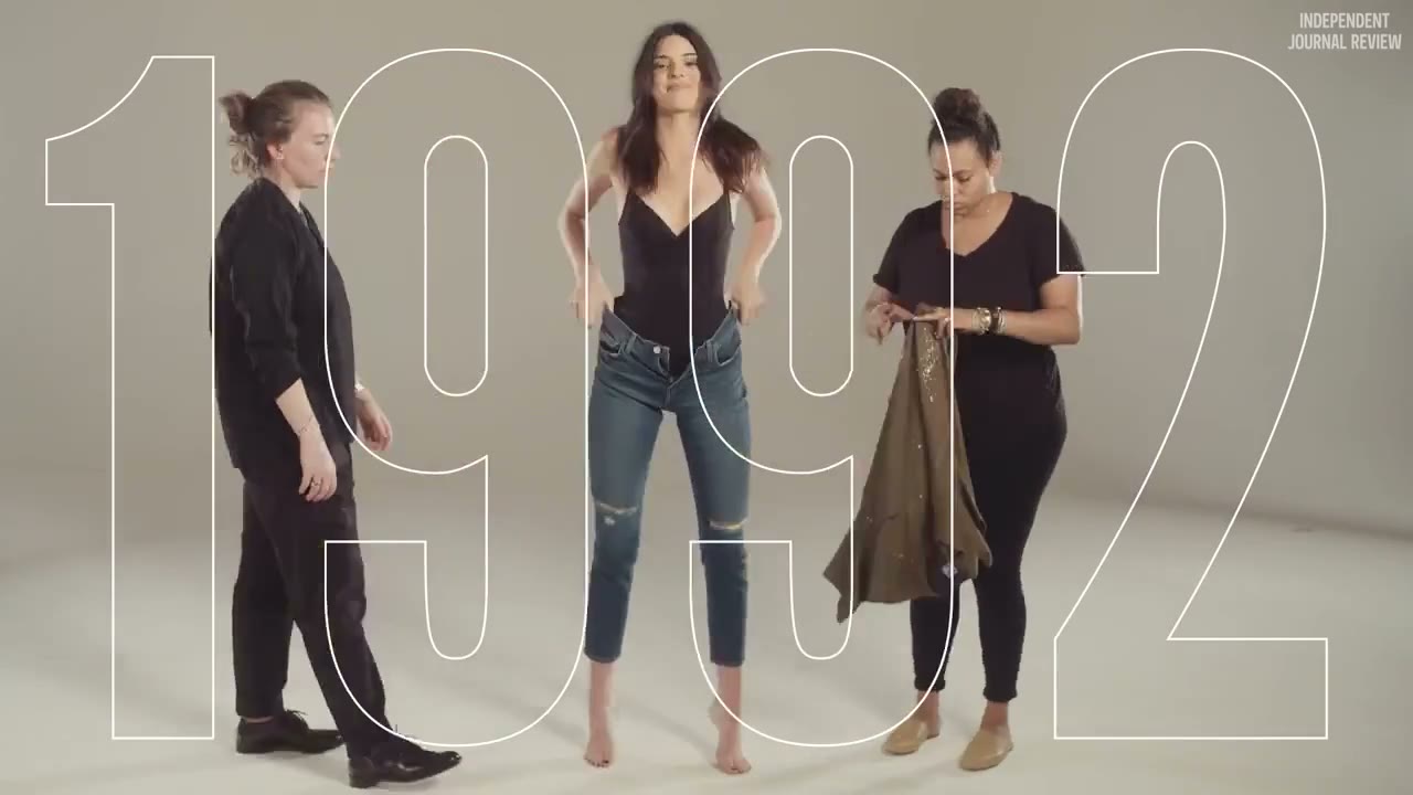 The crew changing Kendall's outfit, 1992 in outline behind her
